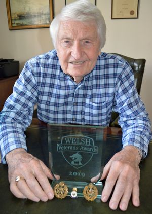 Peter Webber with a Welsh Veterans Award he won in 2019 and his RAF cap badges.