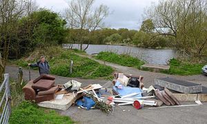 Fly tipping in Litte Dawley. Taking a look is resident Glyn Jones.