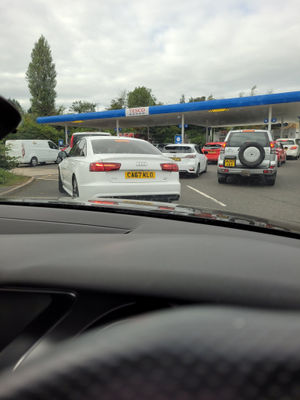 Queues at a Tesco Petrol Station in Dudley. Photo: @SammyCornwall2/PA Wire