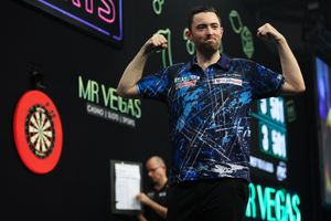 Luke Humphries celebrates his match-deciding nine-darter against Michael Smith at the Mr Vegas Grand Slam of Darts (Picture: Kieran Cleeves/PDC)