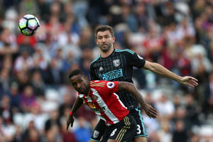 Jermain Defoe of Sunderland and Gareth McAuley of West Bromwich Albion (AMA)