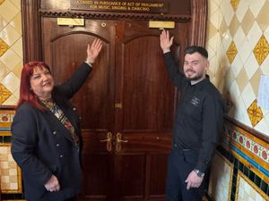 Angela Nelson and Nathan O'Neil with the rediscovered Palace of Varieties sign at the Bartons Arms