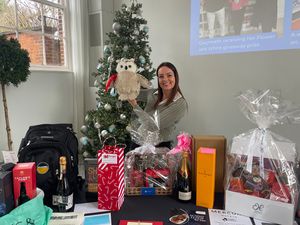 Kelly Riedel with the raffle prizes