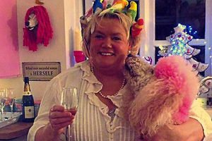 Mandi at home with Gandi her pink poodle