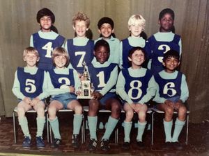 Corinaldi pictured with the trophy and the wonderfully diverse rounders team from Grove Junior School.