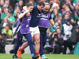 France captain Antoine Dupont, centre, suffered a serious knee injury against Ireland