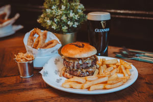 Burger and chips and a pint of Guinness at The Queens Head which has a new menu after a major makeover