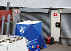 A forensics tent has gone up at the Doulton Trading Centre, Rowley Regis, after a man was found dead.