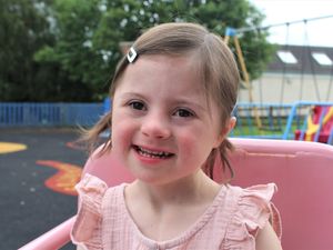 Supporting image for story: All smiles for girl battling heart condition as she starts school and welcomes baby brother