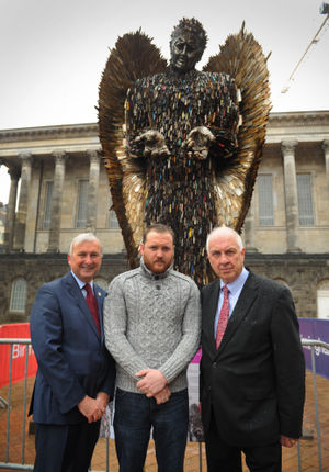 Council leader Ian Ward, artist Alfie Bradley and West Midlands Police and Crime Commissioner David Jamieson in front of the Knife Angel.