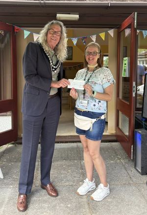 Llandrindod Wells Mayor Councillor Steve Deeks-D'Silva officially opened the garden party and gave a cheque to fundrasier Emma Coates