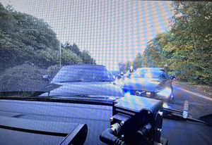 This image shows the moment the two men were stopped by road crime team officers. Photo: Staffordshire Police