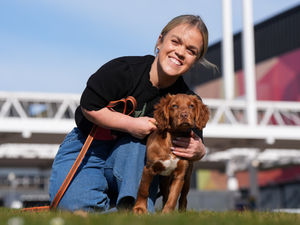 Paralympian Ellie Simmonds, newly announced in the presenting line-up for the Crufts TV show, with a Cocker Spaniel puppy from West Midlands Police during the official launch of Crufts Dog Show 2025 at the NEC Birmingham. PA Photo. Photo: Jacob King/PA Wire