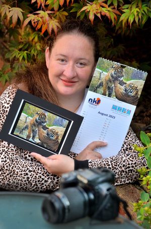 Kathryn Goddard, with her photo of two tigers at Chester Zoo. 