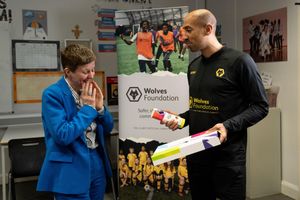 Louisa Craig, Principal of Our Lady & St Chad Academy, is surprised by Wolves Foundation ambassador Karl Henry.