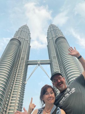 Marianne and Chris Fisher from Telford outside the Petronas Towers in Kuala Lumpur, Malaysia