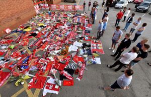 A huge amount of tributes laid next to the entrance of Walsall FC's Bescot Stadium 