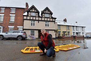David Hegarty's house, the timber framed one at the back, is just 60 metres from the banks of the Severn and has been flooded twice in a year