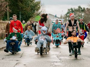 Supporting image for story: Hundreds raised at festive charity wheelbarrow race in Wem