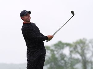 Rory McIlroy, of Northern Ireland, hits on the 14th hole during the second round of the Truist Championship golf tournament at the Philadelphia Cricket Club,