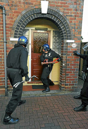 Police raid a house in West Bromwich