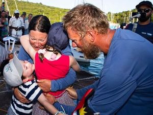 Supporting image for story: Couple complete World's Toughest Row with their children at the finish to greet them