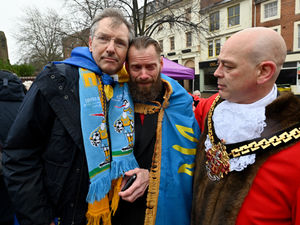 An emotional Mychajlo Fedyk is comforted by Grag Brackenridge after the ceremony