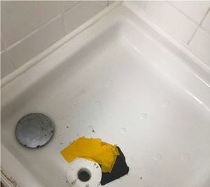 The botched repair of the shower tray