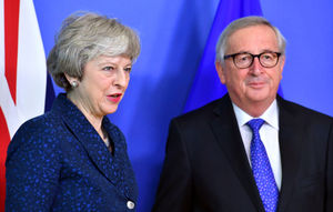 European Commission President Jean-Claude Juncker stands with Prime Minister Theresa May