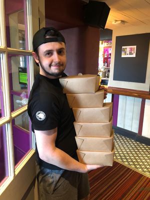 Tom Wilkes will food packages that were delivered to elderly and vulnerable people in the community. Pic: Sam Wilkes