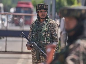 Indian paramilitary soldiers stand guard at a temporary checkpoint in Srinagar, in Indian-controlled Kashmir