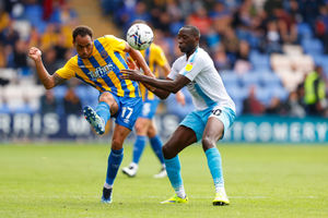 Elliott Bennett of Shrewsbury Town and Lucas Akins of Burton Albion. (AMA)