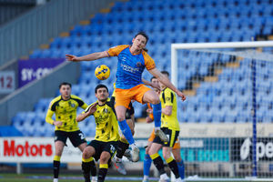 Will Boyle heads clear against Harrogate Town. Picture: Salop Photo