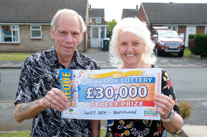 Ronald and Maggie Cooper with his cheque for £30,000