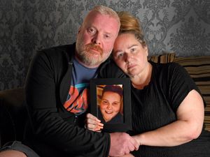 Lynette and Damian Corfield with a picture of their son, Ben