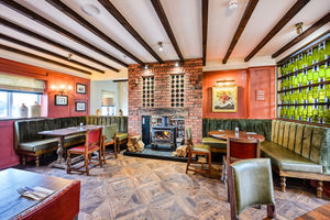 Oak tables are positioned in the revamped restaurant to overlook the vines outside at Halfpenny Green Wine Estate