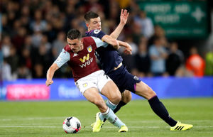 Aston Villa's John McGinn (left)