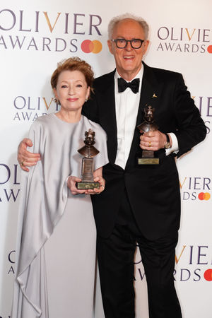 Lesley Manville and John Lithgow in the Winner's Room with the Best Actress and Best Actor awards during the 2025 Olivier Awards with Mastercard at the Royal Albert Hall, London