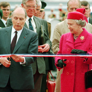 French President Francois Mitterand and the Queen preparing to cut the ribbon at the new terminal for the Channel Tunnel at Coquelles, France, in 1994