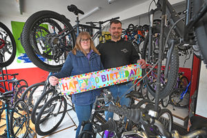 Russell Cycles owner Sue Stanton with Bret Taylor