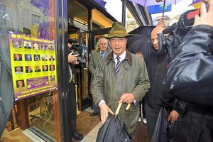 Farage is besieged by the media as he walks through Dudley