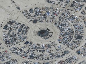 Supporting image for story: Burning Man festival in Nevada desert is washed out by heavy rain