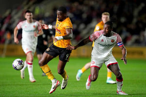 Newport County's Omar Bogle (left) and Walsall's Donervon Daniels battle for the ball during the Sky Bet League Two match at Rodney parade, Newport.  