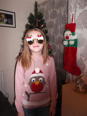 Ruby Huntbatch getting ready for Christmas jumper day at her school. Credit: Donna Huntbatch