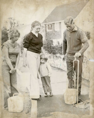 A family using a standpipe after Operation Switch Off cut their water supply