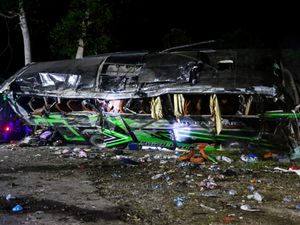 Supporting image for story: At least 11 dead in Indonesia bus crash after brakes apparently failed – police