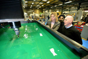 Justine Greening, managing director Mark Wingfield, and Black Country Chamber of Commerce president Ninder Johal view a spark eroder