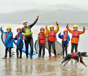Outdoor educator Matty Bowman and Bosley the dog with pupils from John Randall Primary School