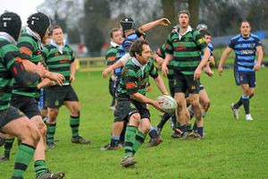 Market Drayton RFC (Green) v Shrewsbury (Blue) at Greenfields, Market Drayton. Phillip Bradley makes a run with the ball for Market Drayton.