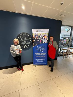 Adam Blake Starbucks Manager - Reedswood branch welcoming Kerry Smith the Oddfellows Social Organiser for the Black Country